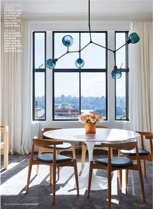  ?? PHOTOGRAPH­S ANSON SMART ?? OPPOSITE PAGE
An ‘IC S1’ pendant light by Flos In the light-filled entrance hall with ITS Signature Curved wall
THIS PAGE
In the dining room, ‘elbow’ CHAIRS by
Carl hansen & Søn And An eero Saarinen ‘Saarinen’ table by Knoll