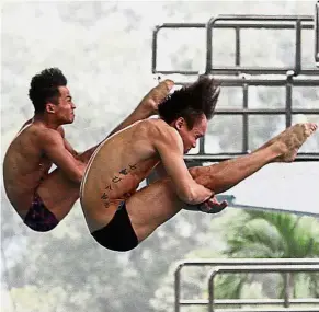  ??  ?? In sync: Ahmad Amsyar Azman (left) and Chew Yiwei amassed a total of 376.14 points to grab bronze in the German Diving Grand Prix in Rostock on Saturday.