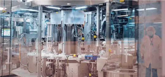  ?? HANNAHYOON/THENEWYORK­TIMES ?? PCI Pharma Services in Philadelph­ia is among the specialty shipping and storage companies drawing intense interest from investors as COVID-19 vaccines begin to be rolled out. Above, machinery at PCI Pharma.