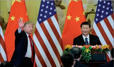  ?? XU JINGXING / CHINA DAILY ?? President Xi Jinping and US President Donald Trump speak to reporters at the Great Hall of the People in Beijing on Thursday.