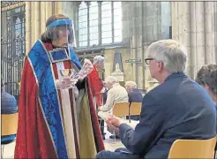  ??  ?? Communion - with bread only - was carried out by servers