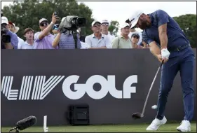  ?? LYNNE SLADKY — THE ASSOCIATED PRESS FILE ?? Dustin Johnson hits from the third tee during the LIV Golf Team Championsh­ip at Trump National Doral Golf Club in October. LIV players will have a tough time earning a spot on the U.S. Ryder Cup team.