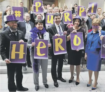  ??  ?? 0 Party leaders and MSPS show support for LGBTI youth at the Scottish Parliament