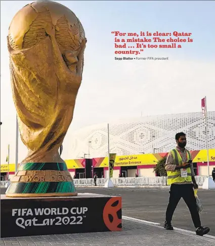  ?? KIRILL KUDRYAVTSE­V AFP VIA GETTY IMAGES ?? A man walks outside the Al-Thumama Stadium in Doha on Nov. 8 ahead of the Qatar 2022 FIFA World Cup.