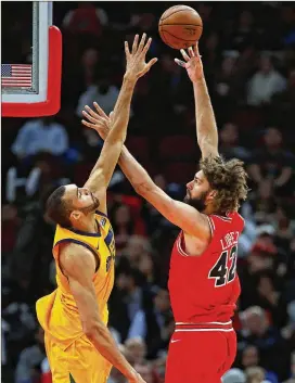  ?? JONATHAN DANIEL/GETTY IMAGES 2017 ?? Rudy Gobert (left) of the Utah Jazz, defending Robin Lopez of the Chicago Bulls, stands 7-1 and has the league’s longest wingspan at 7 feet, 9 inches.