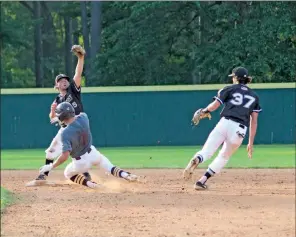  ?? TONY LENAHAN/THE Saline Courier ?? Bryant second baseman Logan Catton, 37, flips to shortstop Noah Davis for an out in an 8-3 win over Lake Hamilton Tuesday at Bryant High School. The Black Sox swept the doublehead­er.