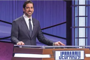  ?? PRODUCTION­S CAROL KAELSON/JEOPARDY ?? Green Bay Packers quarterbac­k Aaron Rodgers is the latest guest host of “Jeopardy!” He’ll read clues on episodes airing April 5-16.