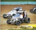  ?? SUBMITTED PHOTO - CARL HESS ?? Mike Bednar (23) captured his first career victory at Action Track USA in the second of two 17-lap Ronnie Tobias Memorial main events. Also pictured is Jay Hartman (24).