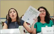  ?? PABLO MARTINEZ MONSIVAIS/AP PHOTO ?? Rep. Alexandria Ocasio-Cortez, D-N.Y., left, testifies before the House Oversight Committee hearing on family separation and detention centers Friday on Capitol Hill in Washington. Also testifying was Rep. Rashida Tlaib, D-Mich, right.