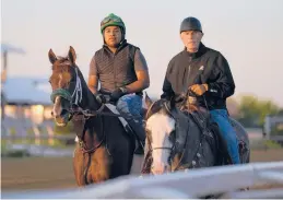  ?? JULIO CORTEZ/AP ?? Hall of Fame trainer D. Wayne Lukas, right, thinks filly Secret Oath, left, has what it takes to deliver him a record-tying seventh victory in the Preakness Stakes.