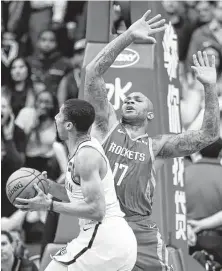  ?? Brett Coomer / Staff photograph­er ?? Against Spencer Dinwiddie and the Nets on Wednesday night, the 6-6 P.J. Tucker, right, served as the Rockets’ center.