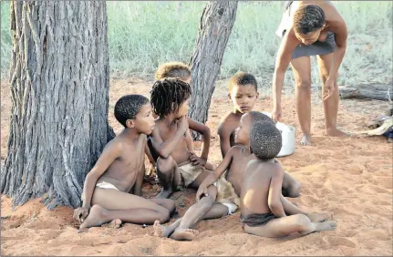  ??  ?? NATURE: Khomani San youngsters enjoying a day under a tree. Pictures: