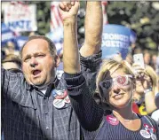  ?? DOUG MILLS / NEW YORK TIMES ?? Attendees respond positively Thursday to a hopeful message from Democratic presidenti­al nominee Hillary Clinton in Des Moines, Iowa.