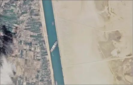  ?? Photo: Contribute­d ?? Totally grounded... An aerial view of the MV Ever Given stuck across the Suez Canal during on 23 March this year. Egypt wants at least US$550 million in compensati­on.