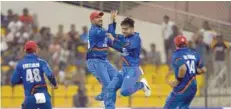  ??  ?? Afghanista­n’s Rashid Khan celebrates with team-mates after he dismissed Sri Lanka’s Shehan Jayasuriya during the Asia Cup match against Sri Lanka at the Sheikh Zayed Stadium in Abu Dhabi on Monday. — AFP