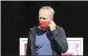  ?? JAN WOITAS — DPA VIA AP ?? Freiburg coach Christian Streich wears a face mask as he arrives for the German Bundesliga soccer match between RB Leipzig and SC Freiburg in Leipzig, Germany, Saturday, May 16, 2020. The German Bundesliga becomes the world’s first major soccer league to resume after a two-month suspension because of the coronaviru­s pandemic.