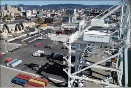  ?? JANE TYSKA — BAY AREA NEWS GROUP ?? Howard Terminal and downtown Oakland are seen from this drone view in 2019. The site is being considered for the Athletics’ new ballpark.