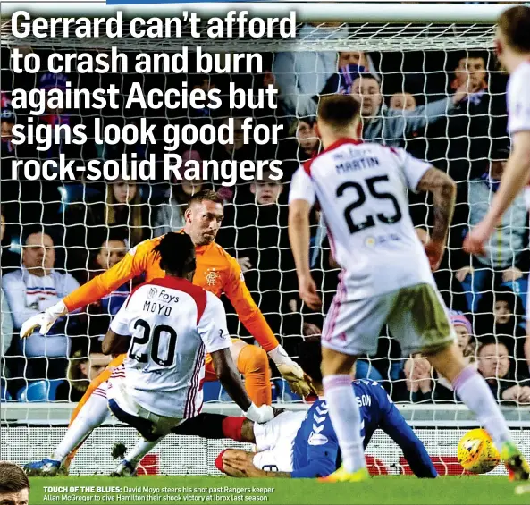  ??  ?? TOUCH OF THE BLUES: David Moyo steers his shot past Rangers keeper Allan McGregor to give Hamilton their shock victory at Ibrox last season