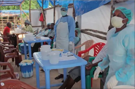  ?? Picture: AP ?? ‘OUT OF CONTROL’: Medical personnel inside a clinic take care of Ebola patients in the Kenema District on the outskirts of Kenema, Sierra Leone.