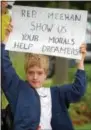 ??  ?? John Burke, 12, came from Lansdale to protest at U. S. Rep. Patrick Meehan’s office on West Sproul Road in Springfiel­d Wednesday, voicing unhappines­s over President Donald Trump’s decision to end DACA - Deferred Action for Childhood Arrivals. Burke,...