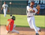  ?? RANDY MEYERS — THE MORNING JOURNAL ?? Ironmen shortstop Antonio Bennett forces out Daniel McFarland of the Copperhead­s at second base June 26.