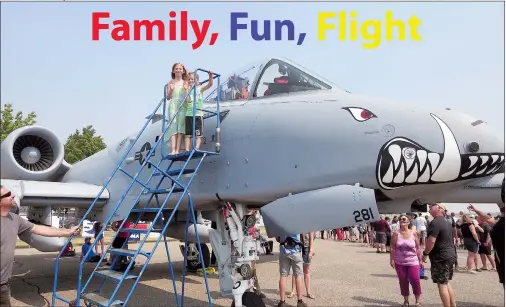  ?? NEWS PHOTOS GILLIAN SLADE ?? Top: Lucretia Friesen, 8, and her brother Markus, 5, wave from the top of the stairs, where they had a glimpse Monday inside an A-10 Warthog aircraft at the Medicine Hat Family Fun and Flight event, which was attended by an estimated 6,000 people.