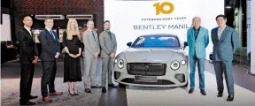  ?? ?? PGA Cars Founder and Principal Robert Coyiuto, Jr. (second from right) and Bentley Manila President Benedicto Coyiuto (right) celebrate the milestone with (from left) Bentley Motors Aftersales Commercial Manager Darren Pluckwell, Aftersales Director Jack Clarke, Sales Manager Jenny Makin, Director of Sales and Network Developmen­t Sam Bontoft, and Product and Pricing Manager Aktar Yacob.