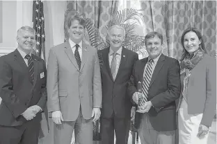  ?? Submitted photo ?? Cooper Tire & Rubber Co.’s operations in Texarkana, Ark., received the Arkansas Governor’s Award in the large manufactur­ing exporter category at the eighth annual Governor’s Awards for Excellence in Global Trade. The award presentati­on included, left,...