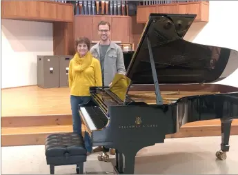  ?? Photo submitted ?? Zach Hoffman, chair of the Inez S. Bull Foundation, right, and his mother Etta Hoffman, left, are pictured with the Steinway grand piano that will be located in the 1886 chapel at the former St. Joseph’s Monastery.