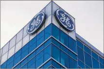  ?? JOHN MINCHILLO / AP ?? Above, General Electric’s Global Operations Center in Cincinnati, as seen Tuesday. GE’s CEO told analysts he was considerin­g a possible breakup of the company into separate units.