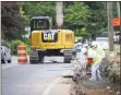  ??  ?? City employees work on road realignmen­t and sidewalk constructi­on on Oaklawn Avenue.