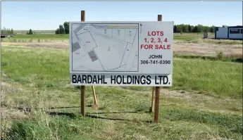  ??  ?? The Bardahl Holdings land in the northeast part of Swift Current. The for sale sign is located on one of the 1.3 acre lots along Adams Street and the 8.12 acre lot is the low-lying area on the other side of a drainage ditch.