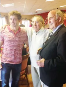  ?? ?? Triple top: Louis Gazzi, centre, in the Gorseinon clubhouse with a pair of local Lions: Leigh Halfpenny, left, and lifelong friend Lewis Jones