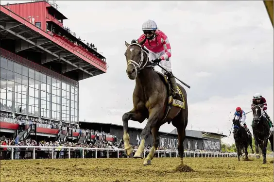  ?? Photos by Skip Dickstein, Tim Lanahan / Special to the Times Union ?? Rombauer, with jockey Flavien Prat, wins the 146th running of the Preakness Stakes at Pimlico Race Course on Saturday. Rombauer rallied in mid-stretch to pull away and win the second leg of the Triple Crown by 31⁄2 lengths over Midnight Bourbon.