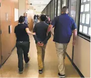  ?? Pablo Lopez / Fresno Bee ?? ICE agents detain an undocument­ed immigrant inside Fresno County Superior Court in July 2018.