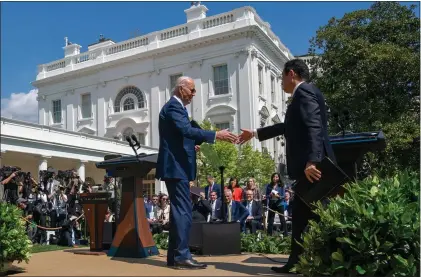  ?? ALEX BRANDON – THE ASSOCIATED PRESS ?? President Joe Biden, left, and Japanese Prime Minister Fumio Kishida shake hands after a news conference in the Rose Garden of the White House on Wednesday.