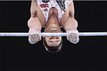  ?? Photograph­s by Wally Skalij Los Angeles Times ?? SAM MIKULAK of Newport Coast competes on the high bar during Olympic team qualifying. He hopes to lead the American men to their first Olympic team medal since 2008, when they won the bronze in Beijing.