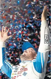  ?? JARED C. TILTON GETTY IMAGES ?? Ricky Stenhouse Jr., who won the Daytona 500 in double overtime and under caution Sunday night, celebrates in victory lane.