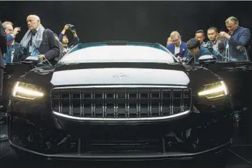  ?? Associated Press ?? THE POLESTAR 1 is unveiled in Shanghai last year. Volvo’s performanc­e luxury brand will reportedly make just 500 of the hybrid vehicles worldwide. Its higher price — $155,000 — and limited availabili­ty are by design.