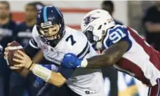  ?? GRAHAM HUGHES/THE CANADIAN PRESS ?? Alouettes defensive end Jesse Joseph tackles Argonauts quarterbac­k Jeff Mathews during the first half in Montreal on Friday night.