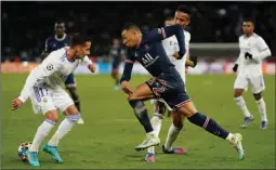  ?? REX/SHUTTERSTO­CK PIC:DAVE WINTER/ ?? Dazzling: Mbappé bursts between Lucas Vázquez and Éder Militão