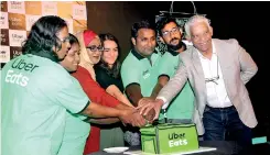  ??  ?? Cutting Uber Eats one-year anniversar­y cake PIX BY PRADEEP DILRUKSHAN­A