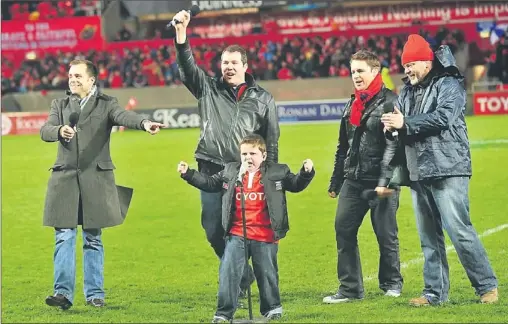  ??  ?? Munster Abú... Abbeyfeale youngster Adam O'sullivan singing his heart out with his buddies, The High Kings, at half time during the Munster V Australia match in Thomond Park. Adam also led the Munster team onto the picth that evening.