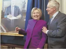  ?? AP PHOTO ?? ‘LIVES ARE AT RISK’: Former Secretary of State Hillary Clinton, with outgoing Democratic Senate Leader U.S. Sen. Harry Reid, spoke on Capitol Hill yesterday for the first time since losing the presidenti­al election.