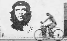  ??  ?? A graffiti depicting the image of legendary guerrilla leader Ernesto ‘Che’ Guevara in a street of Havana. — AFP photo