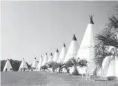  ?? STATE ARCHIVES OF FLORIDA ?? A photograph­er for Florida’s Department of Commerce captured a view of Orlando’s Wigwam Village Motel in 1956. It was demolished in 1973.