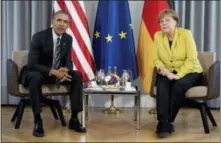  ?? THE ASSOCIATED PRESS ?? President Barack Obama and German Chancellor Angela Merkel meet at Schloss Herrenhaus­en in Hannover, Germany, on Sunday. Obama was in Germany to mount a two-day push to sell his trans-Atlantic trade pact.
