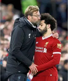  ?? — Reuters ?? The precious
one: Liverpool manager Juergen Klopp kissing Mohamed Salah on the forehead after the winger was substitute­d during the English Premier League match against Leicester on Saturday.