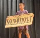  ?? Callie Jones / Sterling Journal-advocate ?? Charlie Bucket (William Visser) is elated to have found the golden ticket in a scene from Sterling Miracle Players Kids Camp's "Willy Wonka Jr."