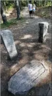  ?? MICHAEL DWYER — THE ASSOCIATED PRESS FILE ?? In this file photo, a stone inscriptio­n marks the actual site of Henry David Thoreau’s cabin on the shores of Walden Pond in Concord, Mass.